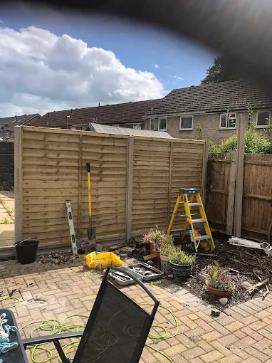 New close-board fence panels in a rear garden