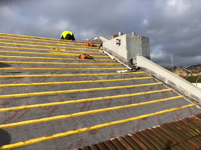 Large scale re-roof in progress with membrane and battens