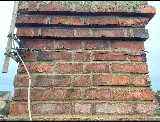 Repointed brickwork on a coastal chimney stack